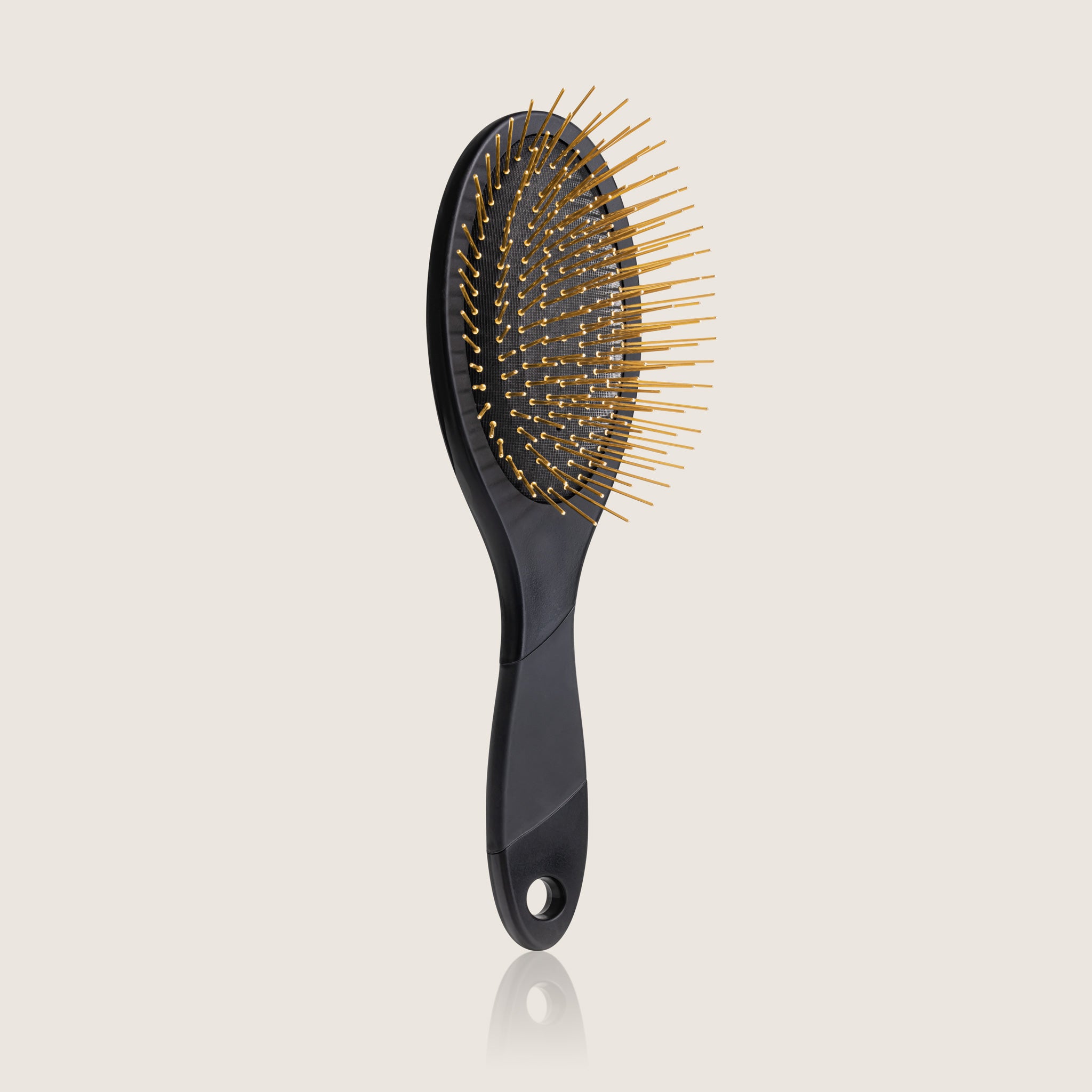 White Edition Thermoplastic Gua Sha Brush by Snow Fox Skincare featuring 24K gold plated acupressure needles for healthy hair and scalp, on light beige background