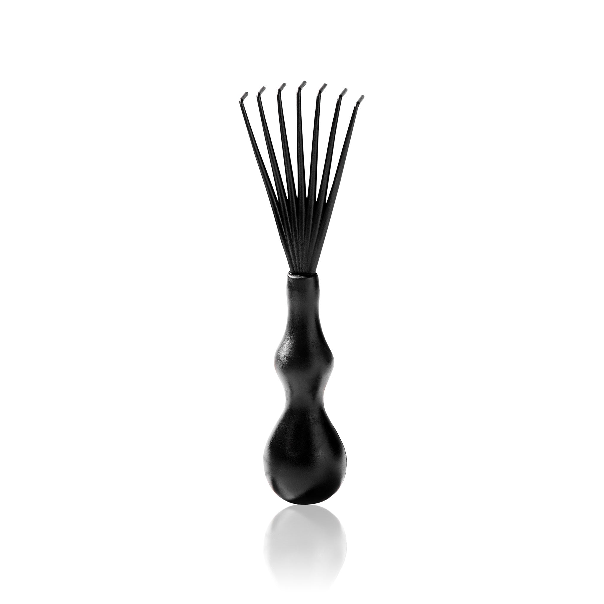 the Snow Fox Skincare Gua Sha Brush Cleaning Kit's rake brush for stray hairs on a light beige background
