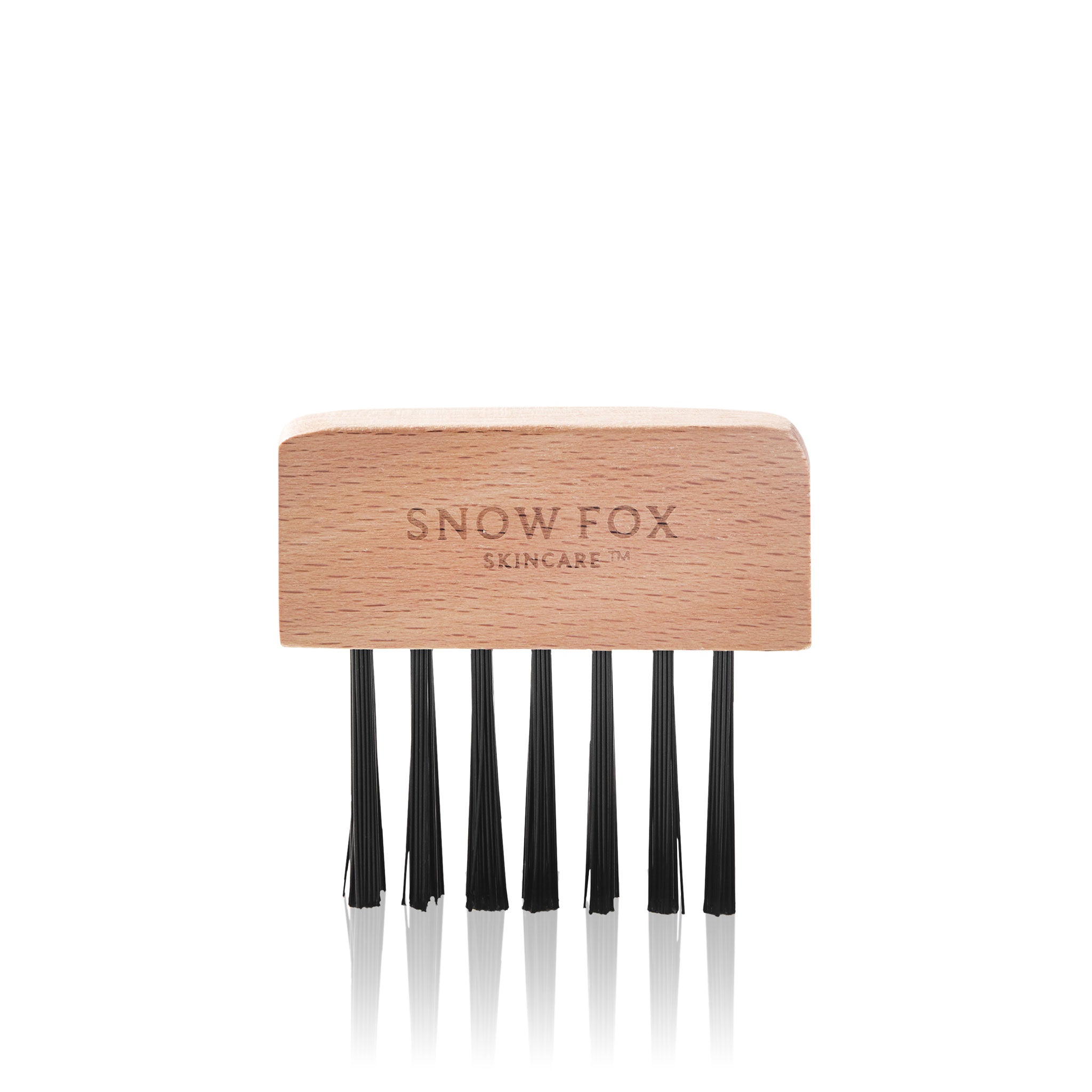 the Snow Fox Skincare Gua Sha Brush Cleaning Kit's bristle comb on a light beige background