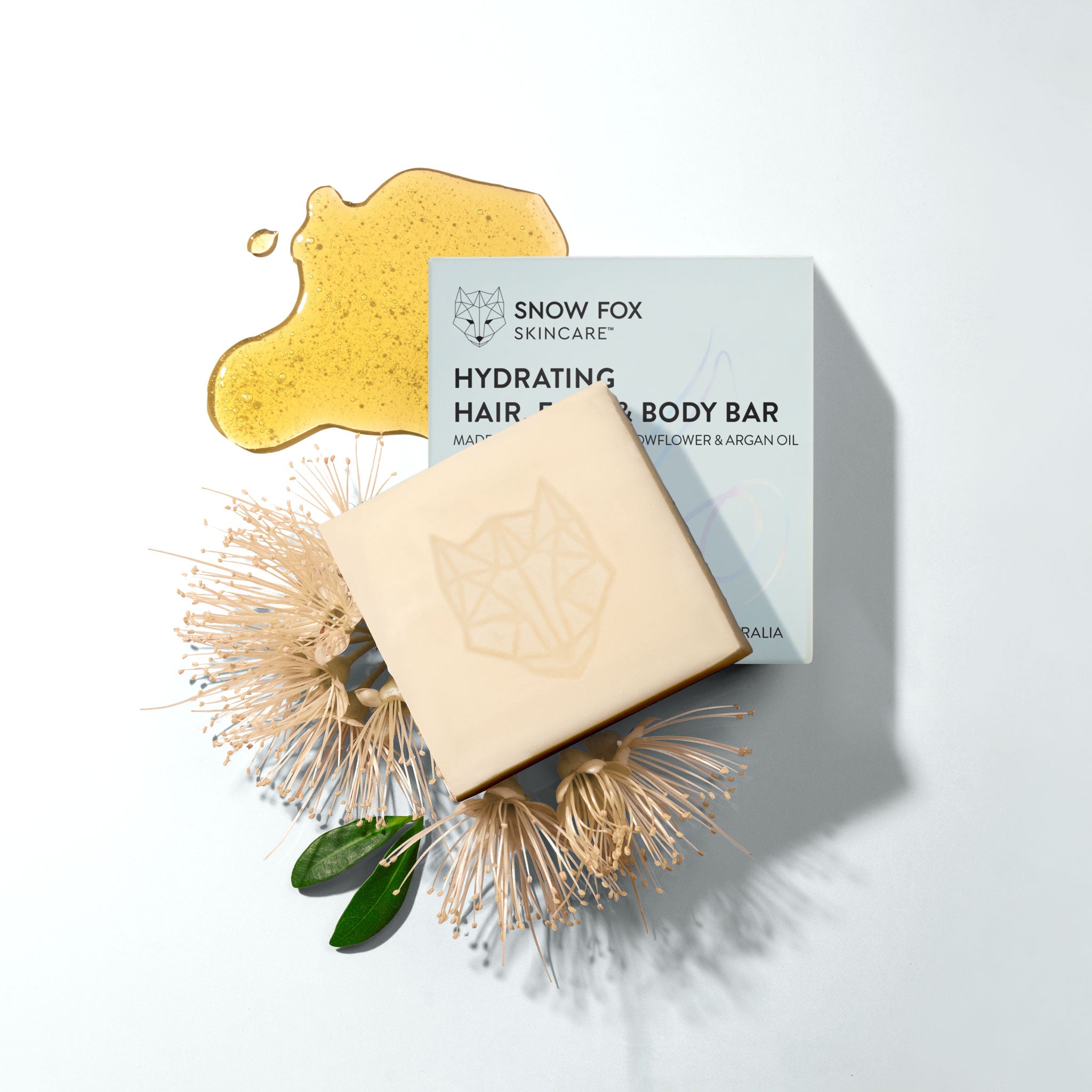 Snow Fox Skincare hydrating hair and body cleansing bar with packaging on a white background