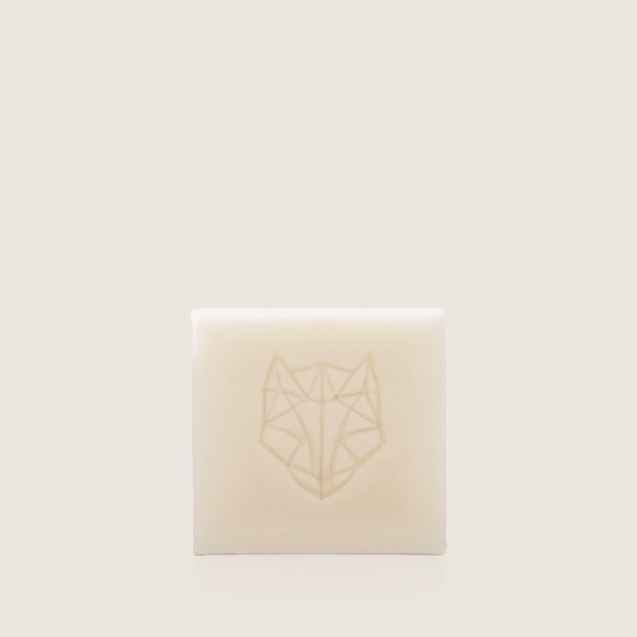 White Hair, Face, Skin Hydrating Cleansing Bar by Snow Fox Skincare, Made in Australia, on light beige background, all natural formula 