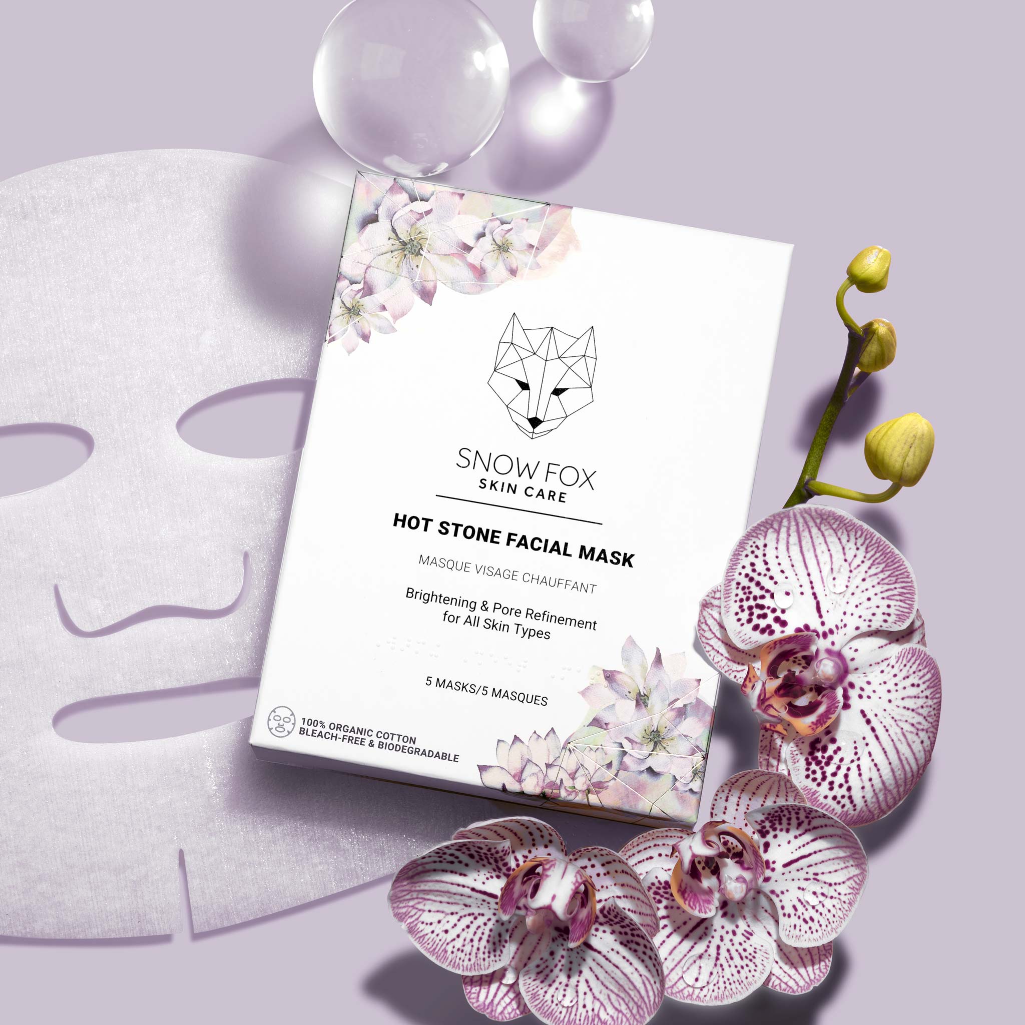 Snow Fox skin care hot stone facial mask packaging with decorative flowers on a light purple background