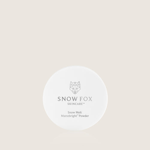 Snow Fox Skincare Mattifying Snow Melt Powder on a beige background