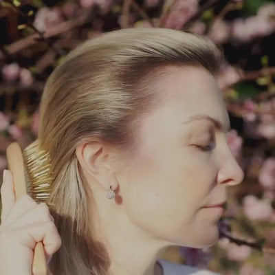 Stimulate acupressure points and promote healthy hair growth with our hand carved 24K gold-plated, premium wooden Gua Sha Hair & Scalp Brush.